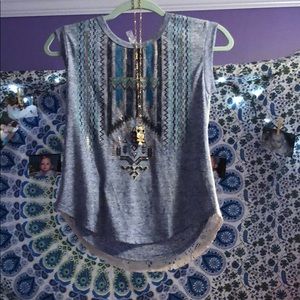 A cute new T-shirt with a owl necklace